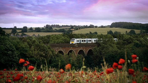 Thameslink train on viaduct going through countryside