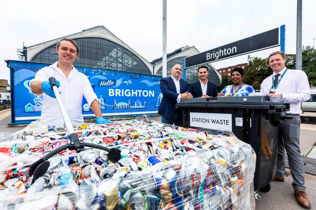 Five people standing in front of the recycling Mobile Segregation Unit at Brighton Station
