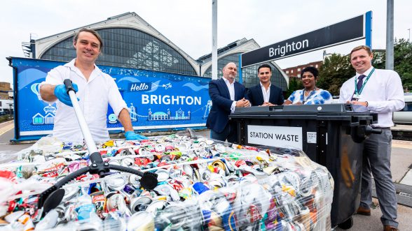 Five people standing in front of the recycling Mobile Segregation Unit at Brighton Station